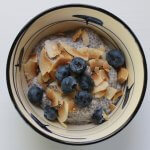 Chia Pudding with blueberries and coconut flakes