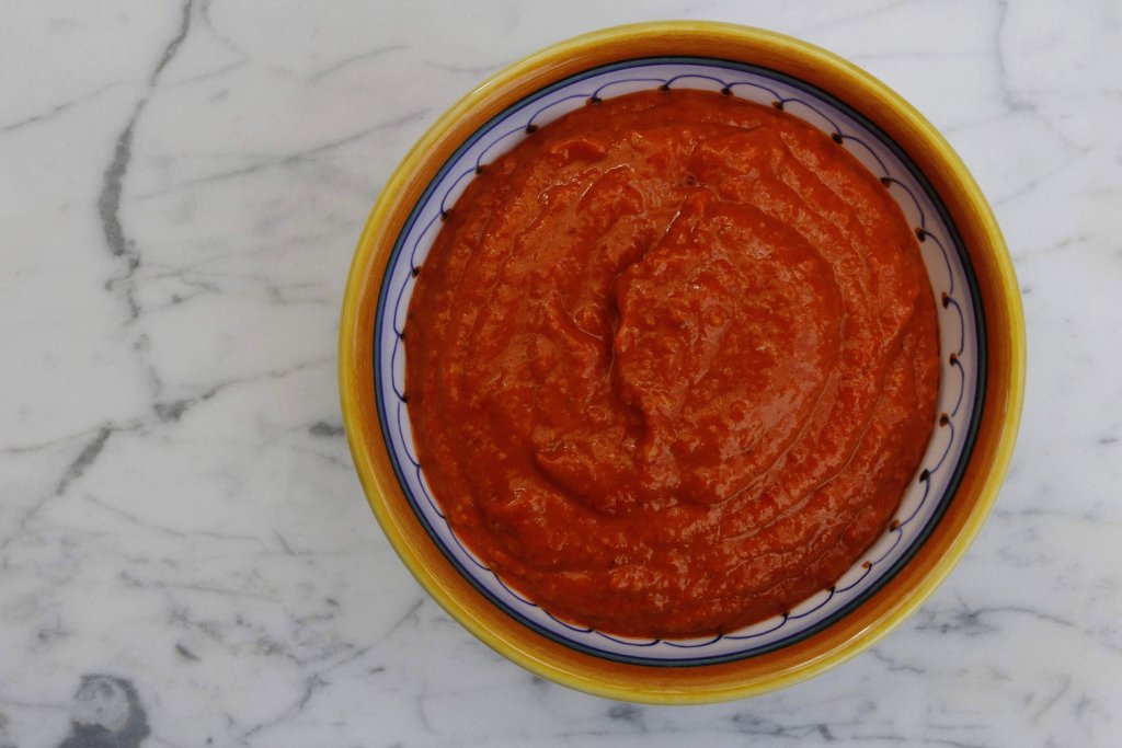 Romesco sauce is a delicious red pepper & nut sauce that originated in Spain. At 1 net carb per serve it's a wonderful low carb option to add to your meal.