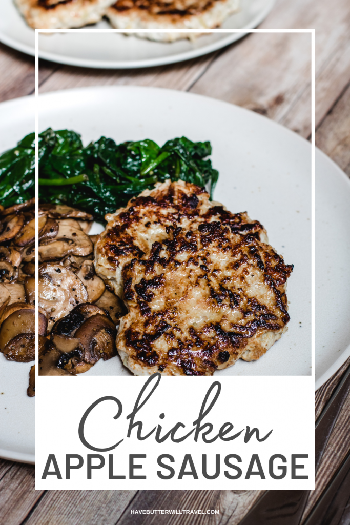 Chicken sausage patties  with mushrooms and sautéed spinach on a white plate