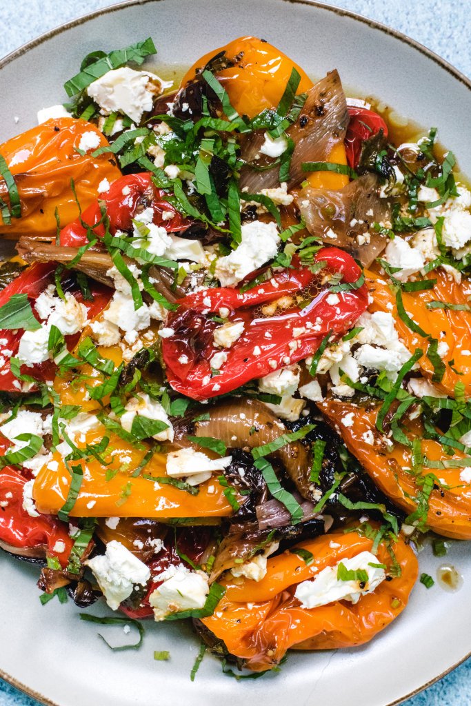 Roasted peppers salad on a light grey plate