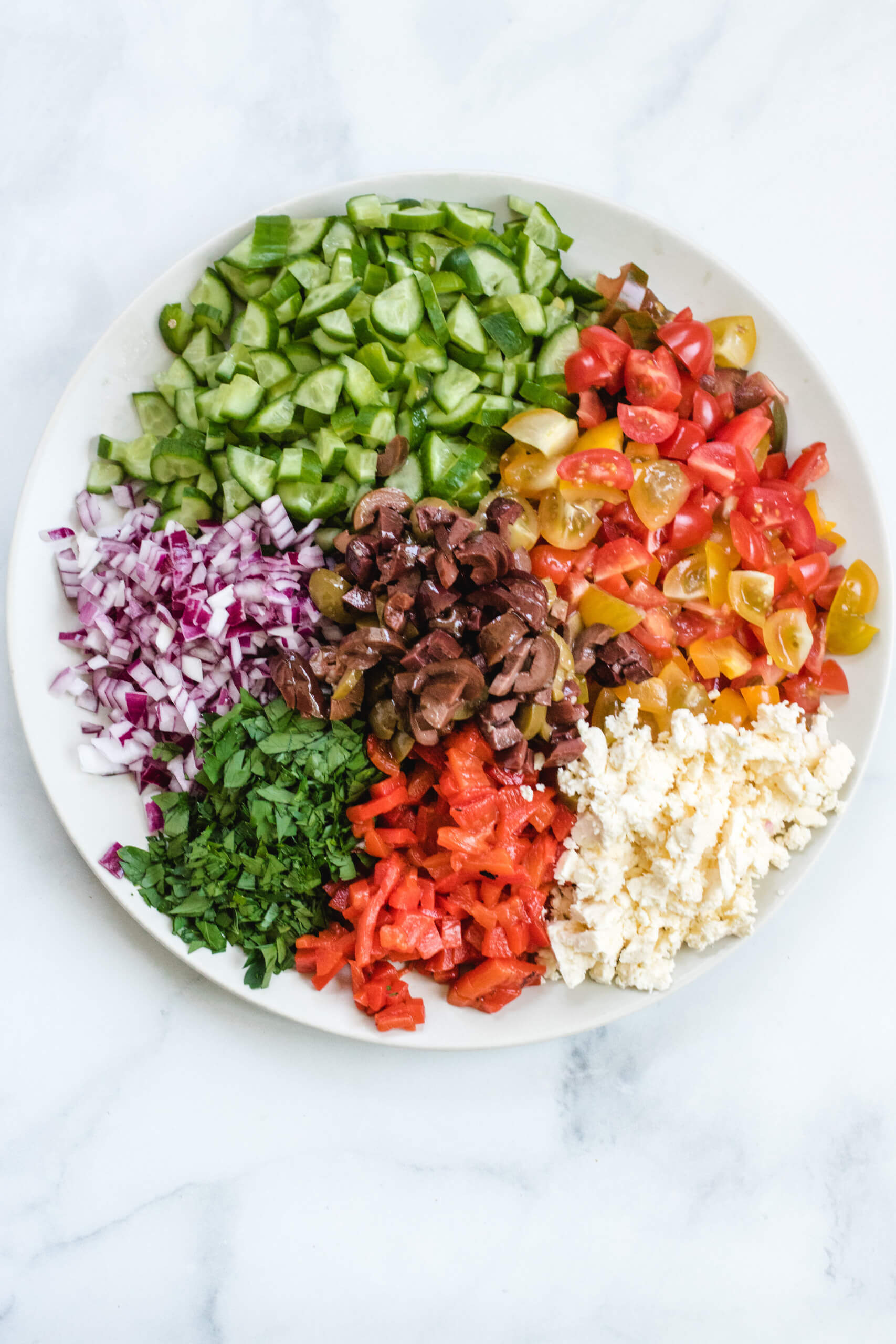 Finely diced ingredients for the Mediterranean chopped salad