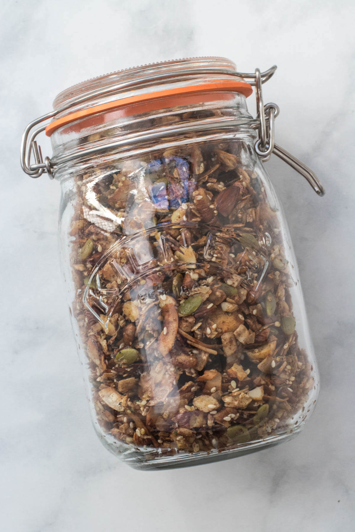Finished and completely granola stored in a glass airtight jar.